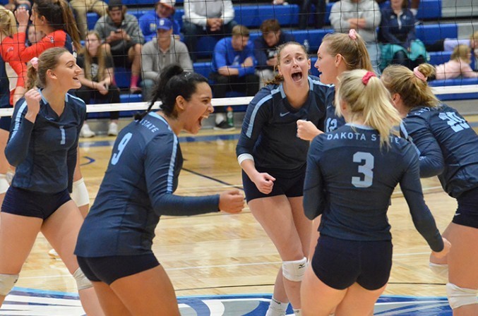 DSU Volleyball team celebrating a point